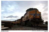 A rare visit to the Anaheim area - UP 5453 a GEVO sits with the hauler power as the sun sets on a stormy sky.