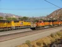 The pass is jointly used by the Union Pacific and BNSF. Here a UP train heading up the hill passes by a BNSF train enroute to Sullivan's curve. The BNSF train was waiting at Cajon on a red signal due to a stalled train further down the hill at Blue Cut.