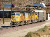 UP 4377 seen here bringing a train of autoracks past the private grade crossing at Cajon.