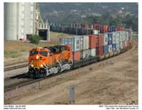 Two new Gevos with BNSF's "New Image" logo pull passed the Cargil facility as seen from Cargil Hill