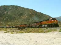 BNSF 4736 pulling a mixed manifest train over the wash near Mormon Rocks on the BNSF north track.