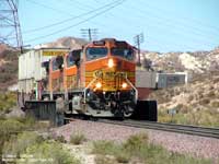 BNSF 5201 leads a mixed intermodal train down the hill on the south track.