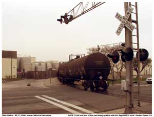 These tank cars are for Plastic Industries Inc. Seen here being pulled westward across Monarch Street by the LOA32.